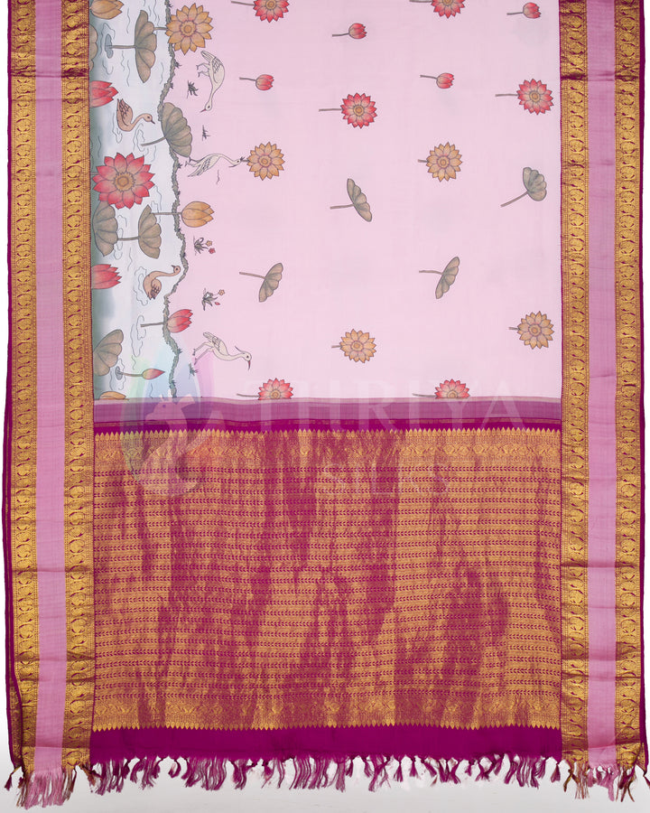 Full pallu view featuring pink body with delicate lotus and swan motifs, and a rich magenta-gold woven pallu.