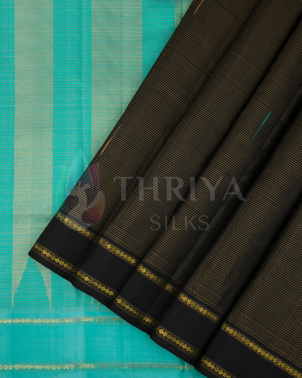 Thriya black silk saree with turquoise border and intricate gold zari pleats detail