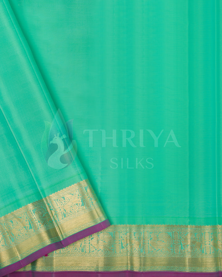 Matching mint green blouse piece with gold zari edging – included with Thriya Kanchipuram silk saree set