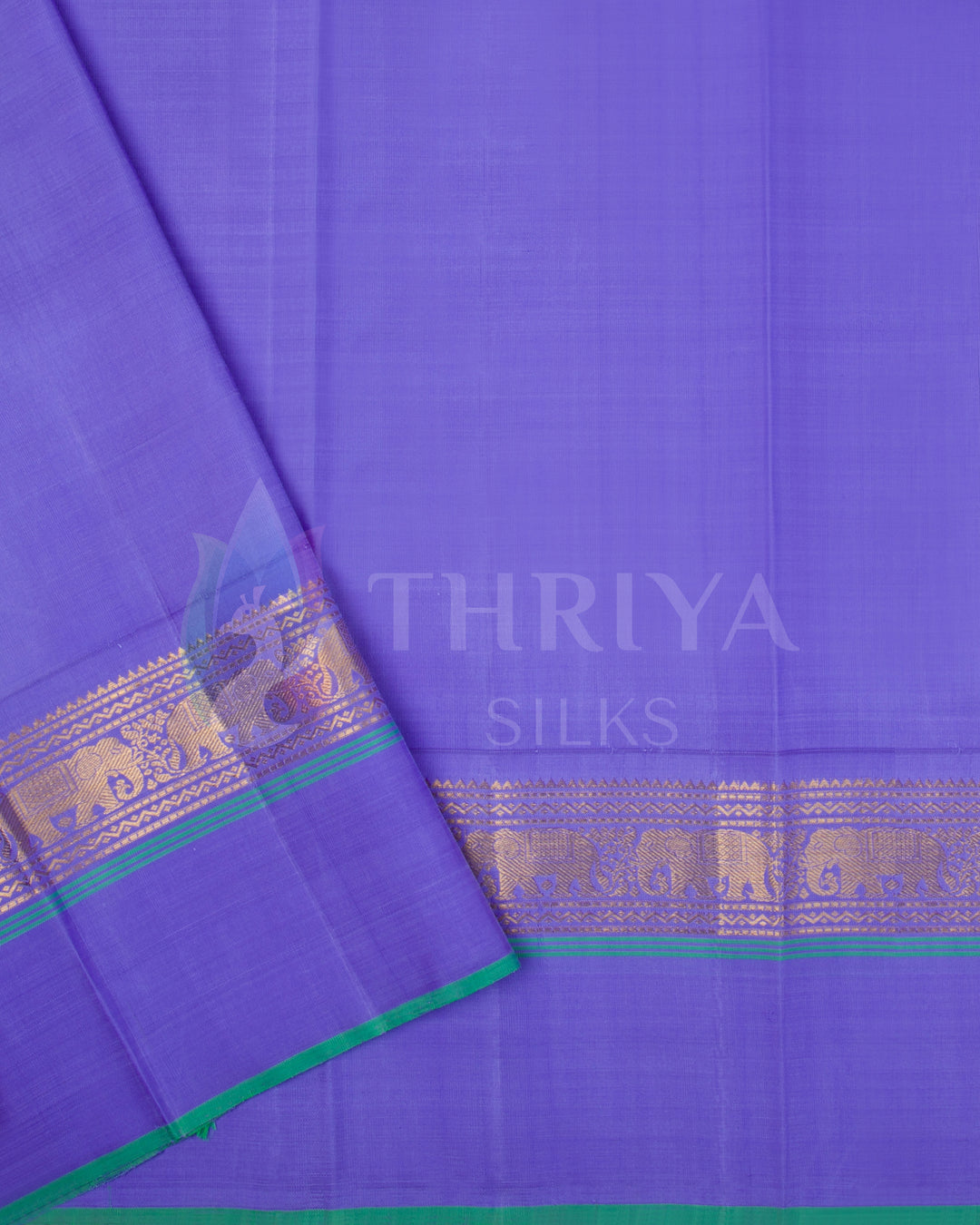 Violet pallu and blouse section of Kanjivaram silk saree with golden zari and green piping