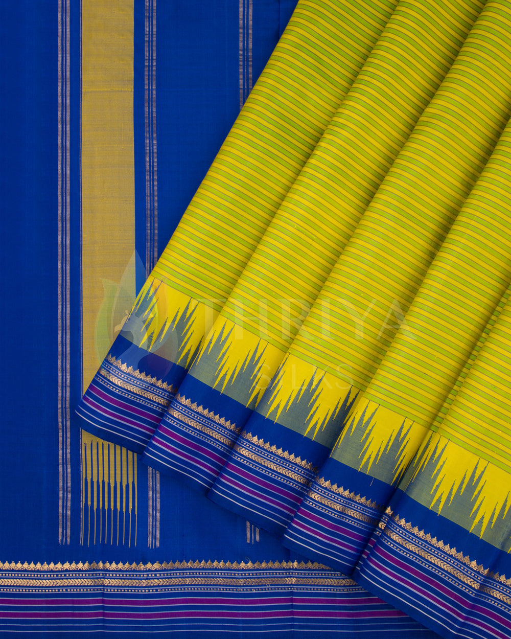 Yellow-green silk saree pleats with intricate blue and golden border design, from Thriya Silks