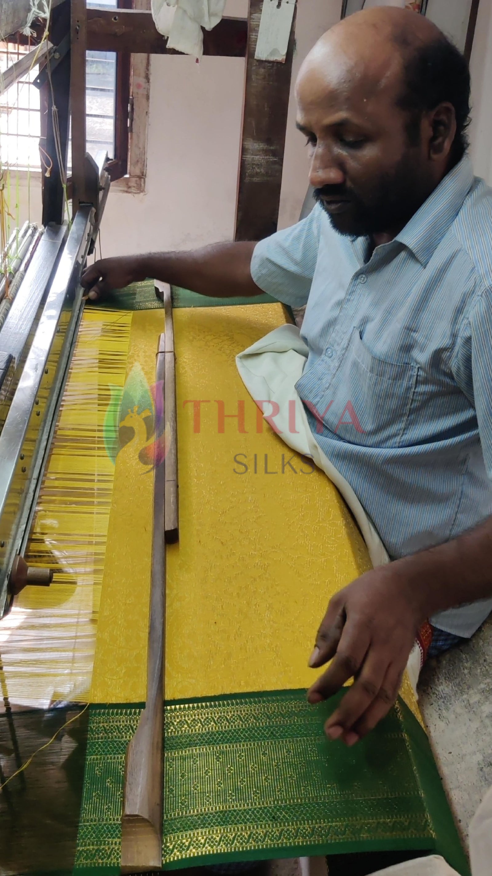Indian handloom weaving process showing yellow and green silk saree being crafted