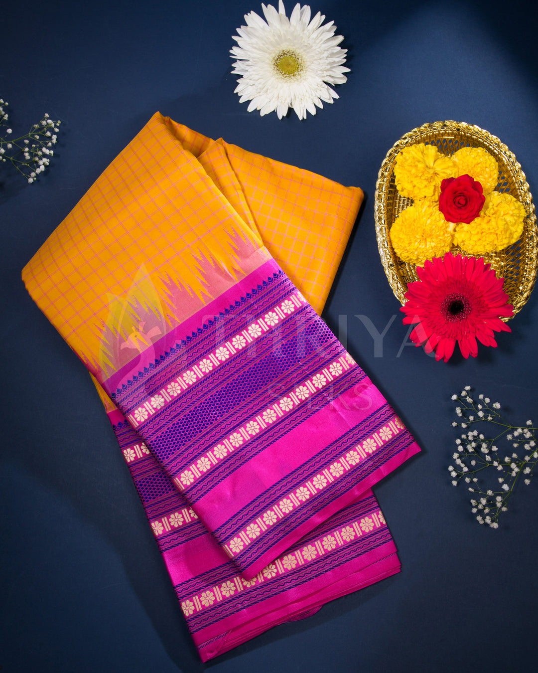  Yellow and pink Kanjivaram silk saree styled with floral decor, perfect for festive wear