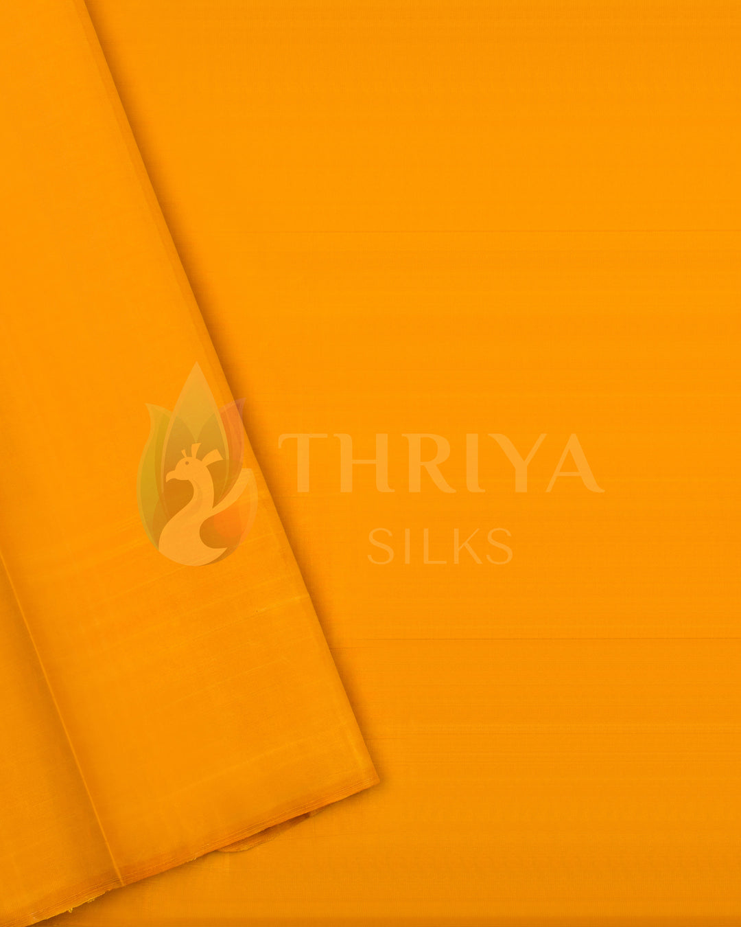 Bright yellow silk blouse piece matching green and yellow saree, from Thriya Silks